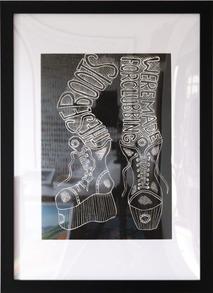 Framed artwork featuring boots and lettering illustration by Paignton artist and illustrator Frances Mason
